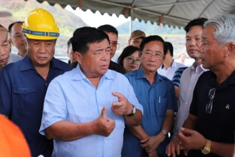 Investment minister inspects projects in southern Laos